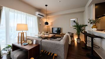 Design Apartment | Living area | Flat-screen TV