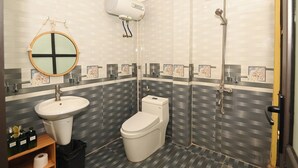 A bathroom with a toilet, sink, and shower. - Bright/In Old Quarter/ 3 mins walking to Hoan kiem Lake/city view (Hà Nội)