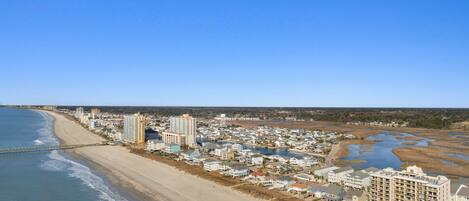 On the beach, sun-loungers