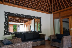 Three Bedroom with Private Pool Villa | Living room | 50-inch Smart TV with digital channels - The Gardens Seminyak (Seminyak)