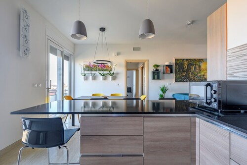 Contemporary apartment in the beating heart of Bologna with amazing skyline view
