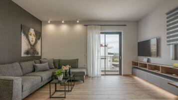 Deluxe Apartment, 2 Bedrooms, Balcony, Mountain View | Living area | Smart TV