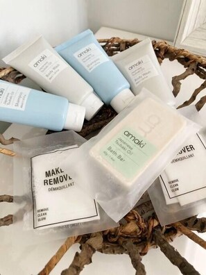A collection of Amaki skincare products, including body wash and shampoo, arranged in a basket. - Farmhouse & Cottage near DT, USC (Lexington County)
