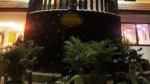 A multi-story building with a central water feature and balconies. - La Capannina Ristorante & Hotel Patong (Patong)