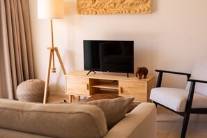Deluxe Apartment, 2 Bedrooms, Accessible, Pool View | Living area | 70-cm LED TV with digital channels - New seahorse residence (Koh Samui)