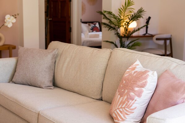 A beige sofa with three cushions in a living room. - New seahorse residence (Koh Samui)