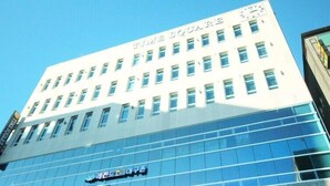 A modern building with the sign "TIME SQUARE" on the top. - Time Square Hotel (Yangsan)