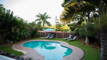 Outdoor pool, open 7:00 AM to 7:00 PM, pool loungers