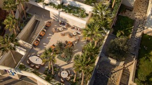A modern hotel with a rooftop pool, multiple balconies, and outdoor seating areas. - Mirari Boutique Hotel (Split)
