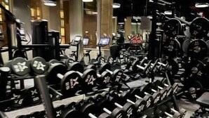 A gym with rows of dumbbells and weight machines. - New Luxury apt,Javits Center,NYC (New York)