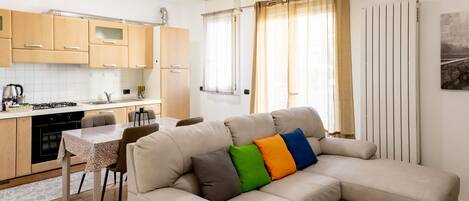 Deluxe-Dreibettzimmer | Wohnbereich