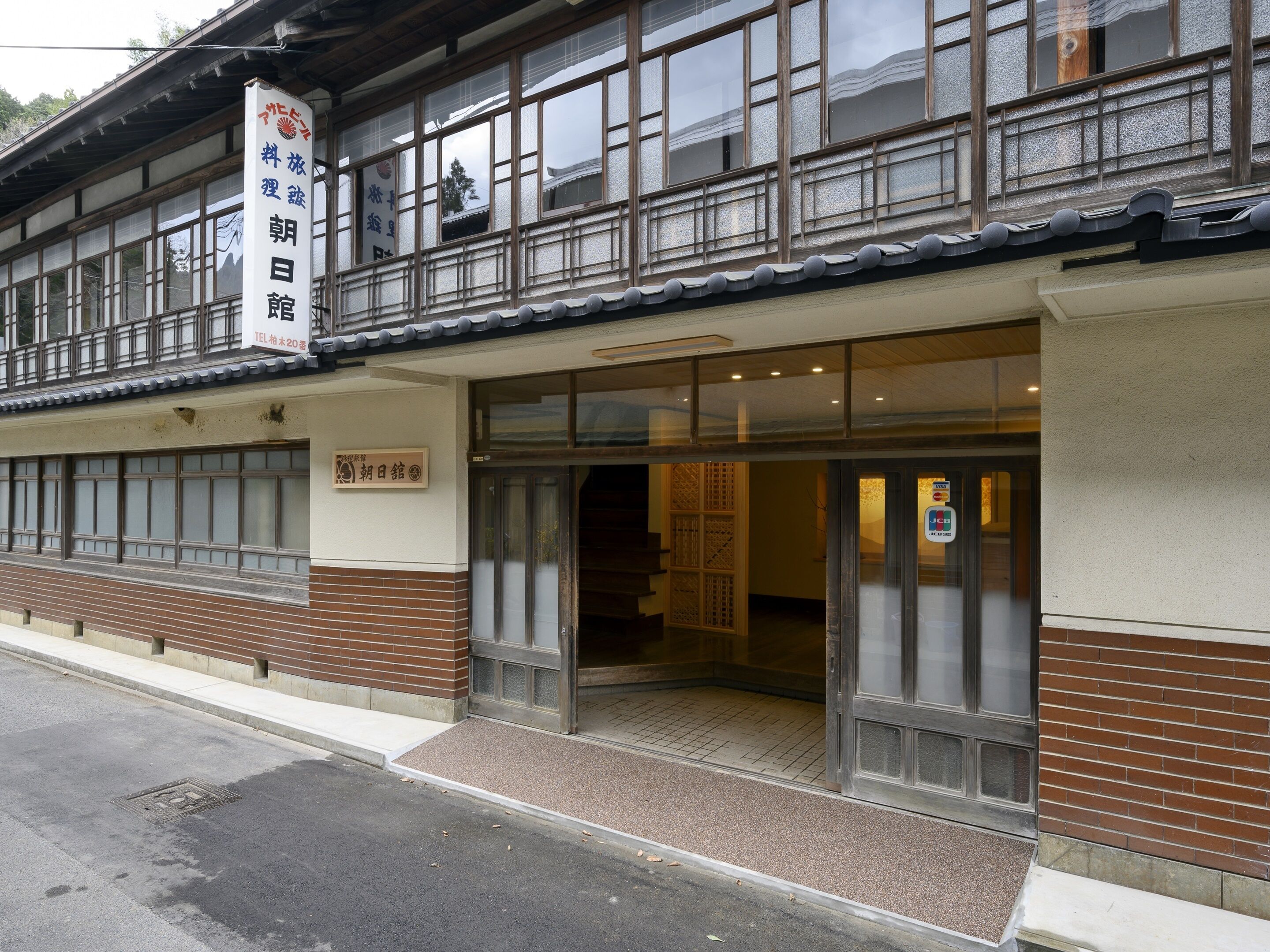 A traditional Japanese building with a sign indicating it is a restaurant.