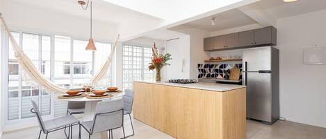 City Apartment | Private kitchen | Full-size fridge, microwave, cookware/dishes/utensils, kitchen islands