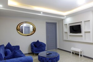 Chambre Deluxe | Coin séjour