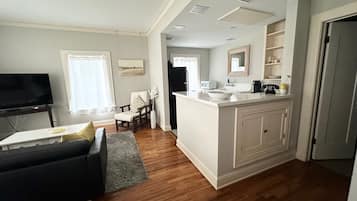 Large Studio | Living area | 55-inch Smart TV with satellite channels