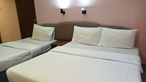 A hotel room with two single beds and one double bed, all with white linens. - Hotel O Wawasan Inn (Sarikei)