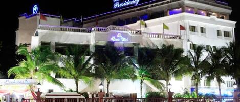 A hotel with a prominent sign reading "The Presidency."