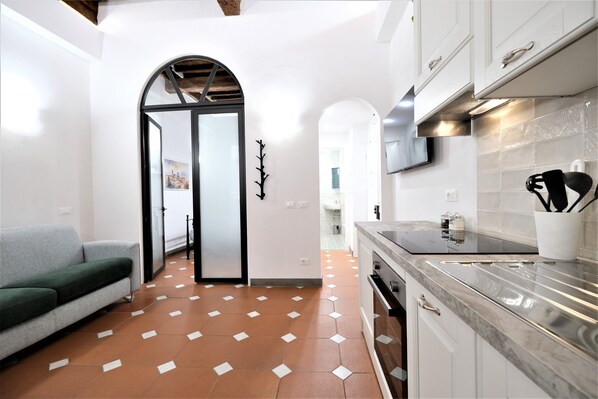 Apartment | Living area | 70-inch flat-screen TV with digital channels