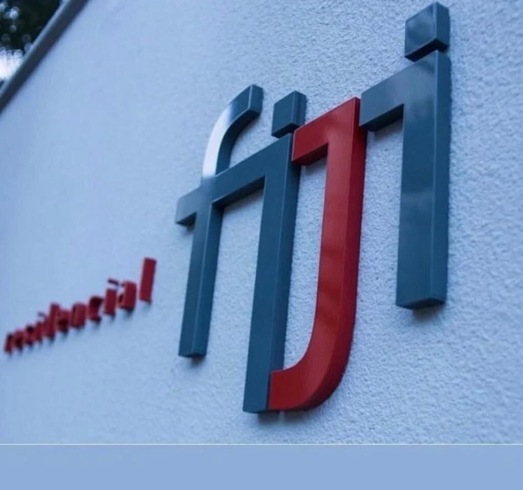 A building sign with the word "fiji" in large letters.