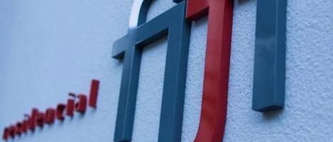 A building sign with the word "fiji" in large letters.