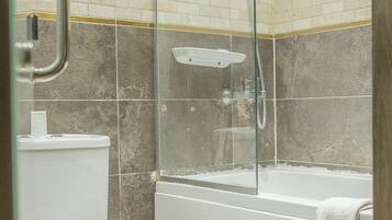 Bathtub, deep soaking tub, designer toiletries, hair dryer