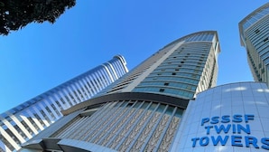 A modern building with a sign reading "PSSSF TWIN TOWERS". - Fairview Luxury Apartments (Dar es Salaam)