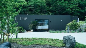 A modern building with a sign reading "BLANC FUJI". - BLANC FUJI (Fujiyoshida)