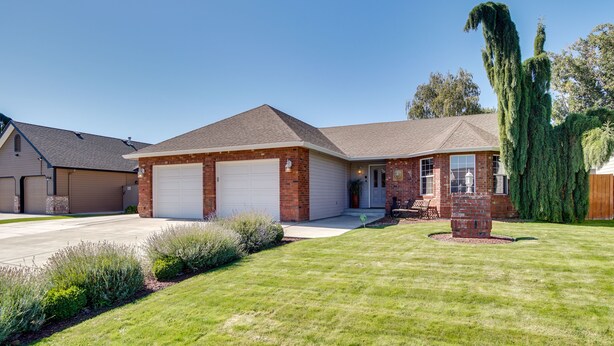 A two-story house with a garage, a brick exterior, and a well-maintained lawn. - 6 Mi to Dtwn Yakima: Central Washington Home (Yakima)