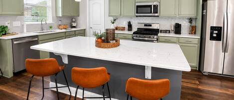 Coffee/tea maker, fridge, microwave, oven