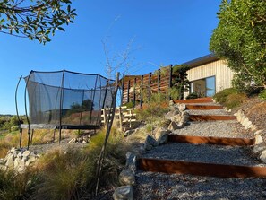 Property grounds - Mount Arthur View modern cottage with garden, fruit trees & cat! (Redwood Valley)