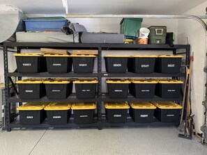 Storage area with labeled bins for organized essentials.