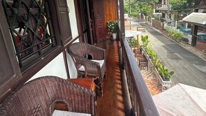 A balcony with wicker furniture and a star decoration.