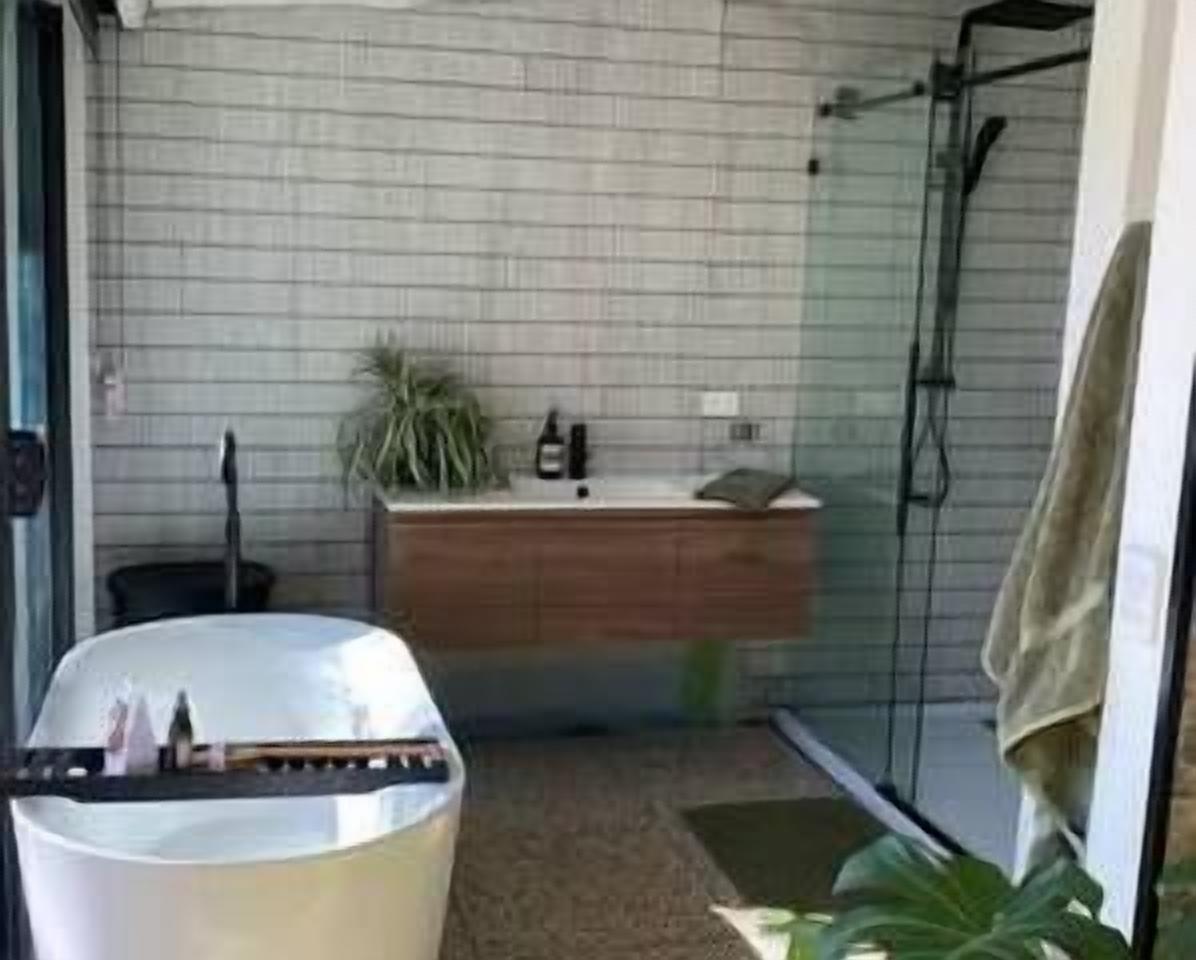 Bathtub, hair dryer, towels