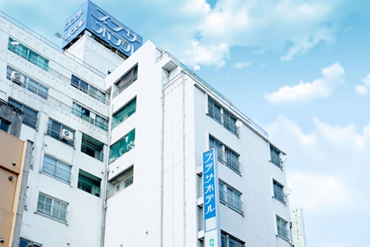 A multi-story building with signage indicating a business or commercial use.