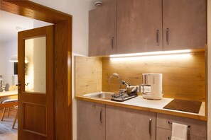 Fridge, microwave, stovetop, coffee/tea maker