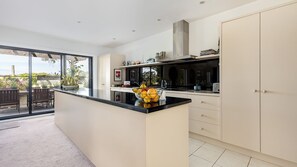 Enjoy meals in the kitchen with an oven, range hood, and ample counter space.