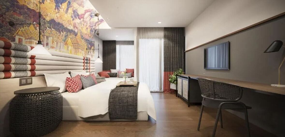 Ein modernes Schlafzimmer mit einem großen Bett, einem Schreibtisch und einem Stuhl.