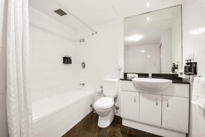 Bathtub, hair dryer, towels