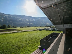 A modern building with a flat roof and a large open space in front. - Der Pinsler by Interhome (Fügen)