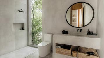 Bathtub, hair dryer, towels, shampoo
