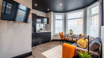 Junior Suite, 1 Double Bed, Kitchen, Partial Ocean View | Living area | 43-inch Smart TV with digital channels, Netflix, streaming services