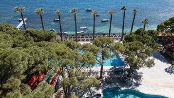 Indoor pool, 6 outdoor pools, open 8:00 AM to 7:00 PM, pool umbrellas