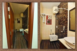 Executive kamer | Badkamer | Een douche, gratis toiletartikelen, badjassen, pantoffels