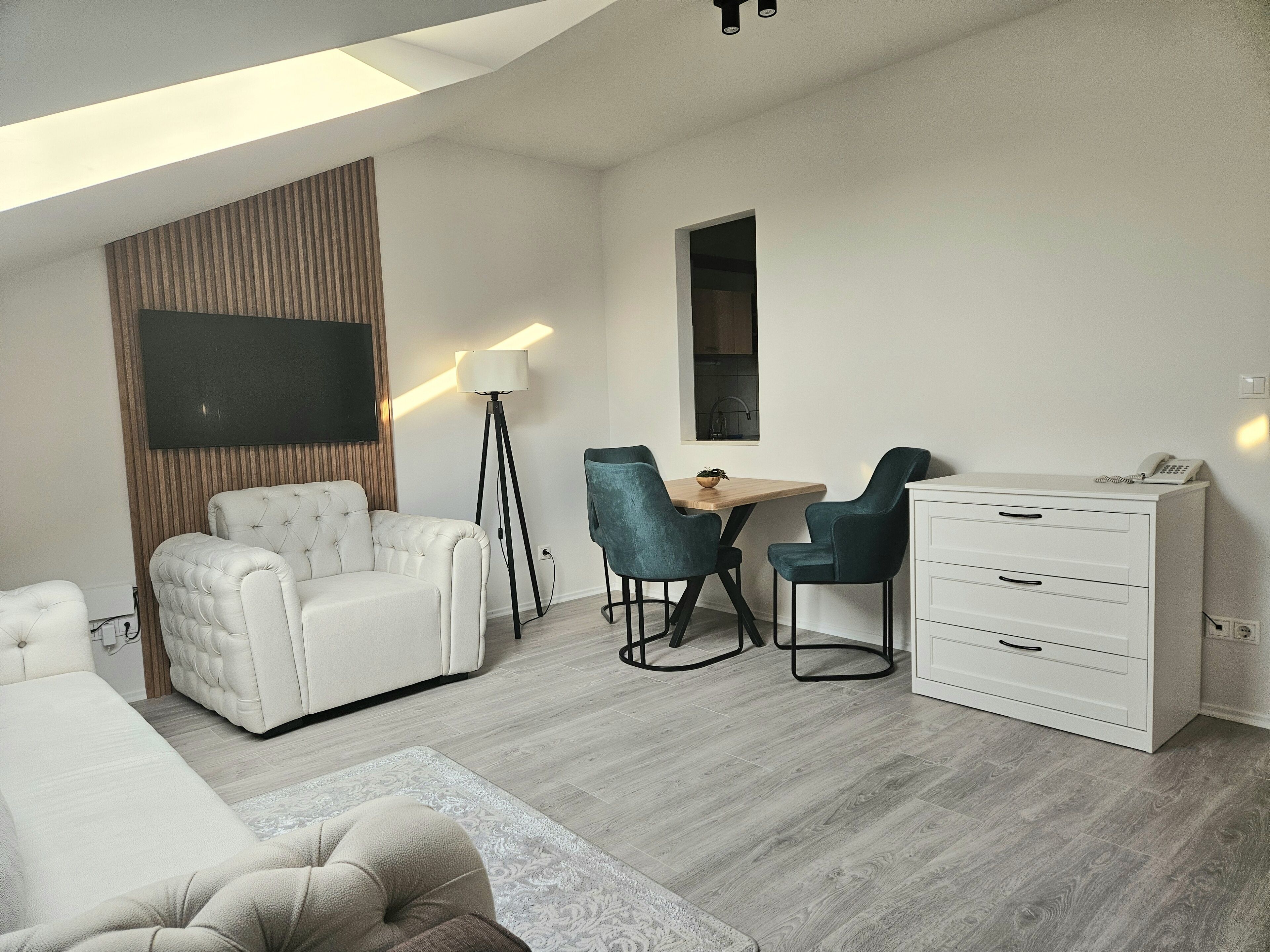 Junior Suite | Living area | 55-inch LCD TV with cable channels