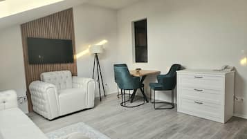 Junior Suite | Living area | 55-inch LCD TV with cable channels