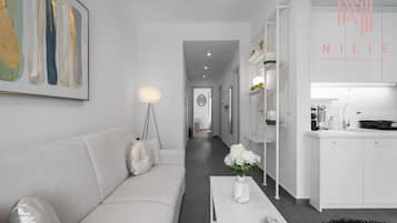 Deluxe Apartment | Living area | Flat-screen TV