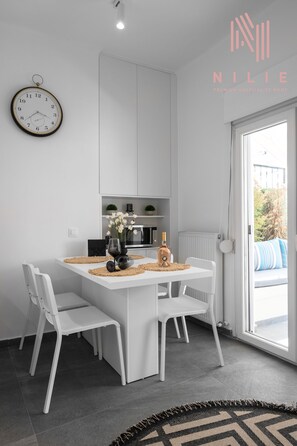 Deluxe Apartment | Living area | Flat-screen TV - Lusso Bianco Nilie Hospitality MGMT (Thessaloniki)