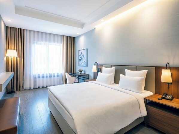 Dobbelt- eller tomannsrom – standard | Sengetøy av topp kvalitet, minibar, safe på rommet og skrivebord