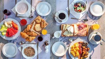 A breakfast buffet with various food items and beverages.