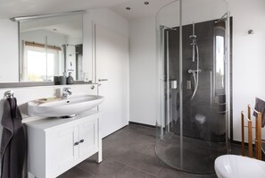 Shower, hair dryer, towels, soap